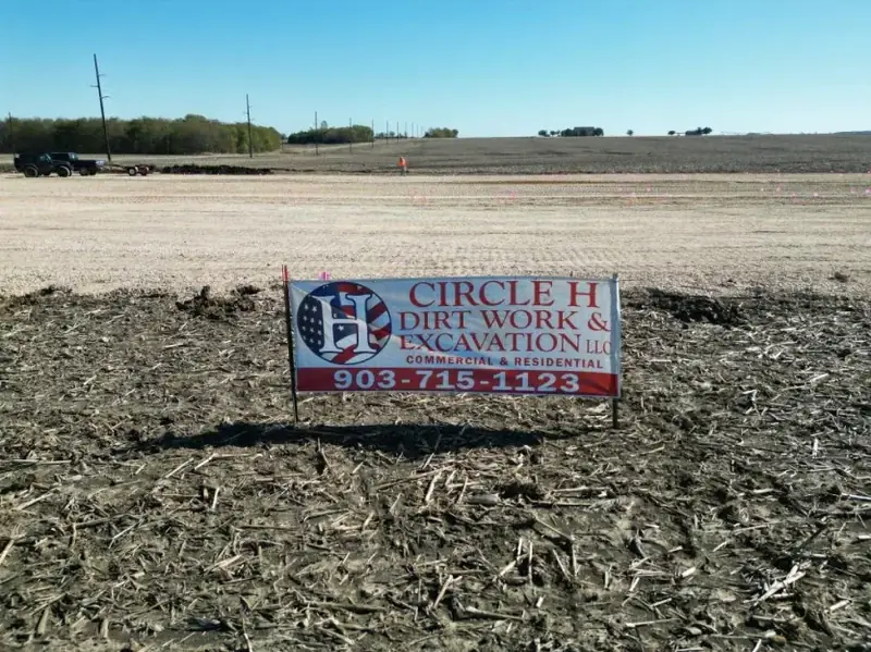 Circle H Dirt Work & Excavation job sign on a graded site
